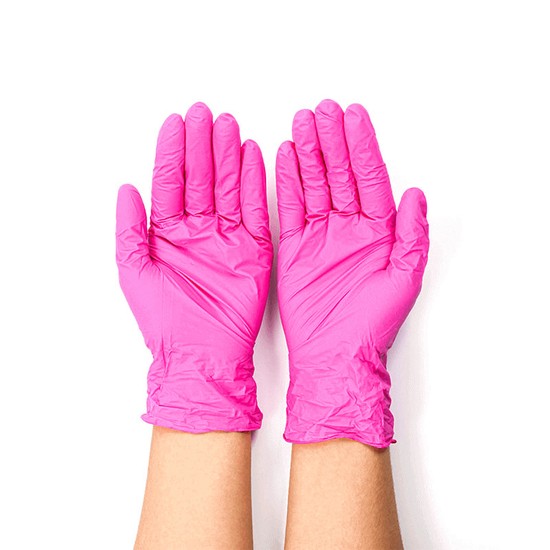 Luvas odontológicas na cor rosa.